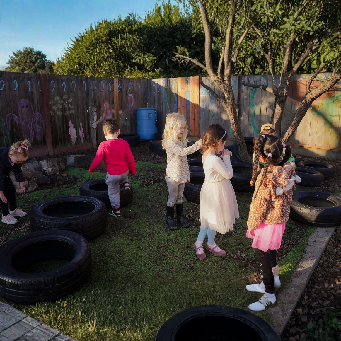 Children exploring nature at daycare in Alameda